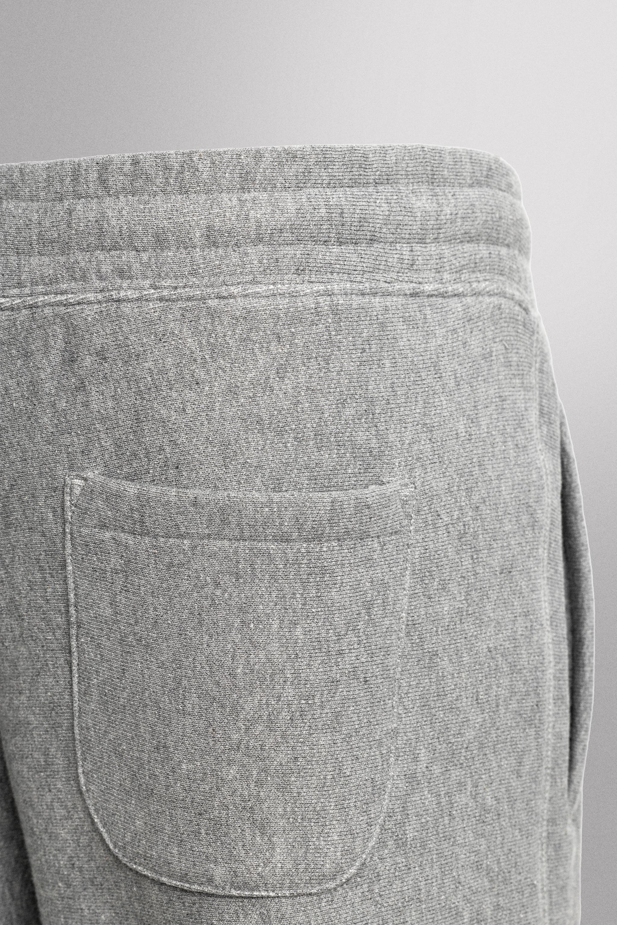 JOGGING PANTS WITH PRINTED TEXT